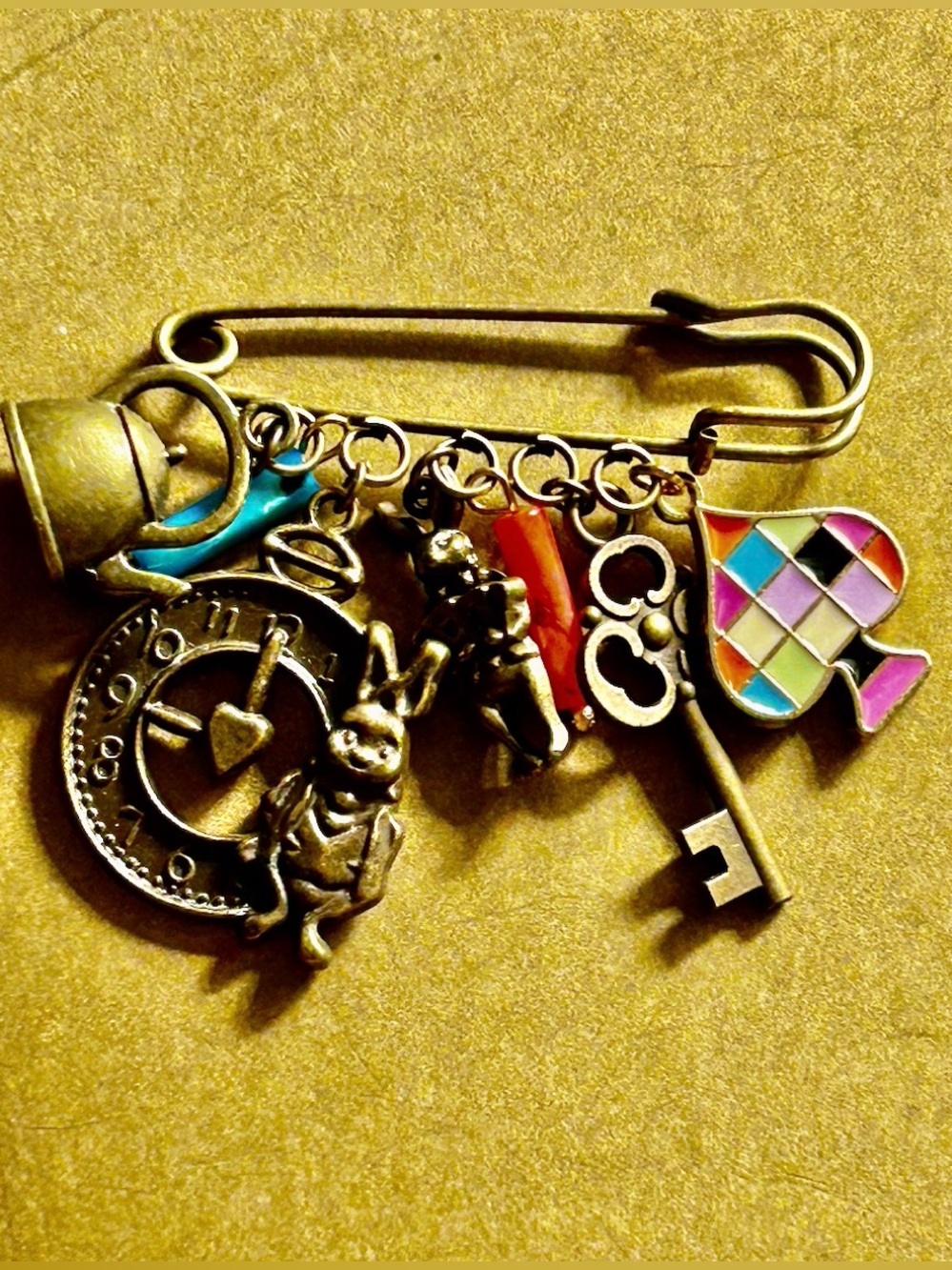 NWOT Safety Pin Brooch Alice in wonderland rabbits, teapot, key, clock charms